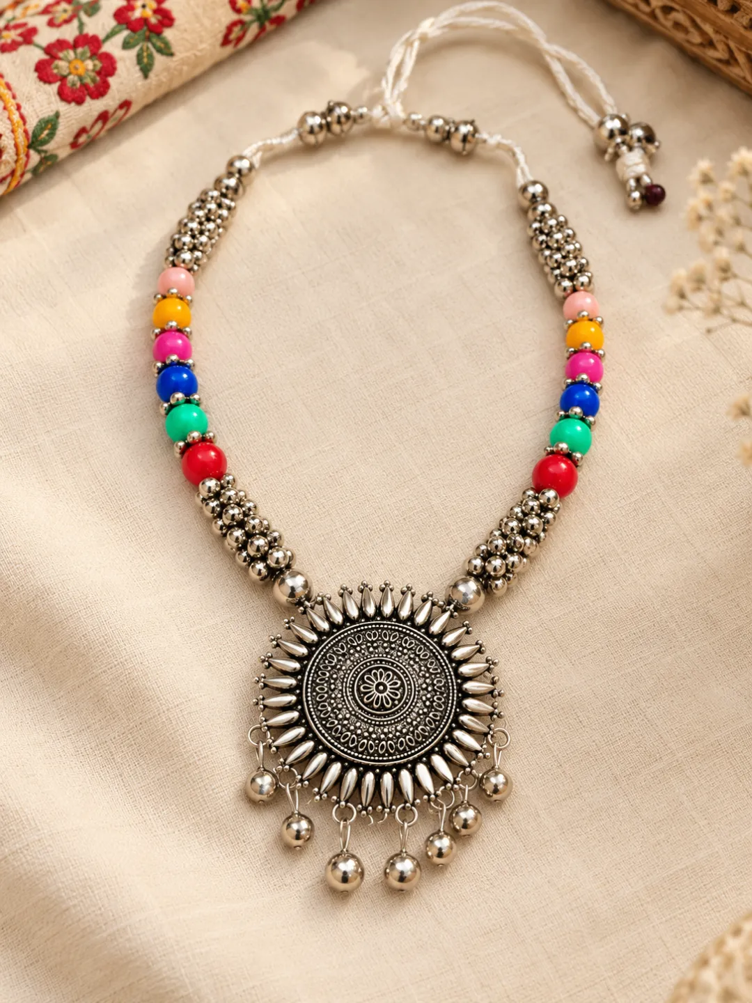 Sunburst Pendant Bead Necklace — flat lay with the adjustable cord