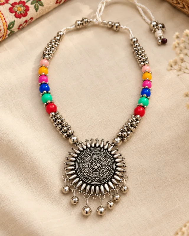 Sunburst Pendant Bead Necklace — flat lay with the adjustable cord