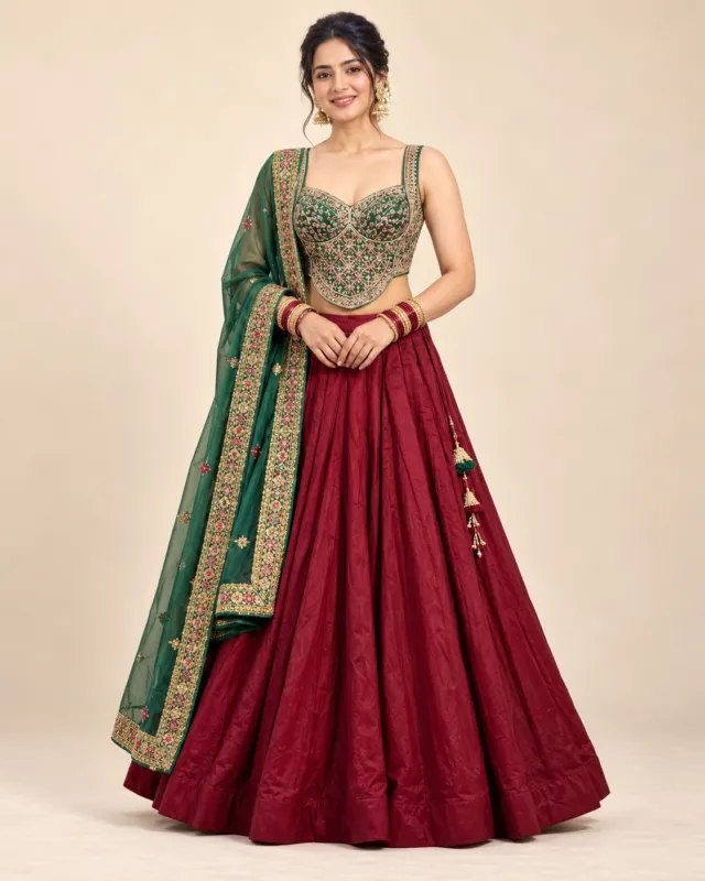 Maroon Lehenga with Green Embroidered Corset Choli — front view of the maroon skirt, green choli and dupatta