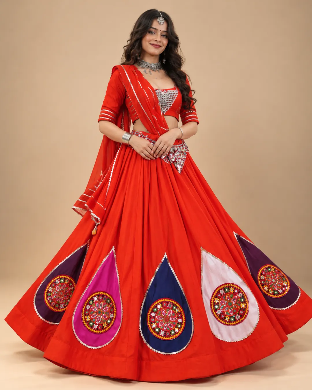 Orange-Red Lehenga with Mirror Teardrop Appliqué — front view of the teardrop appliqués and mirrored choli