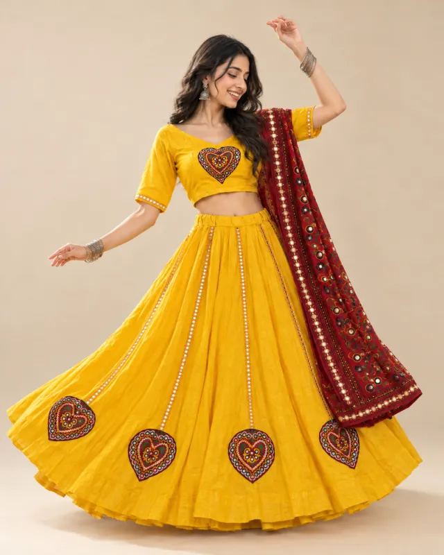 Marigold Yellow Lehenga with Heart Mirror Motifs — mid-turn with the heart motifs showing