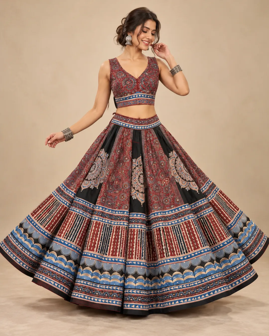 Rust & Indigo Ajrakh Print Panelled Lehenga — mid-turn with the banded hem open