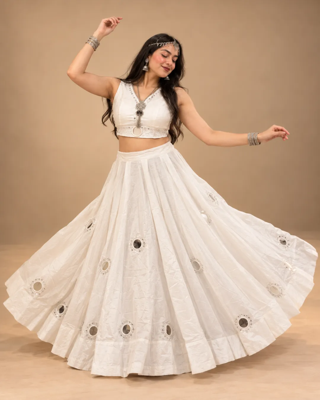 Ivory Tone-on-Tone Mirror Work Lehenga — mid-turn with the mirrors catching
