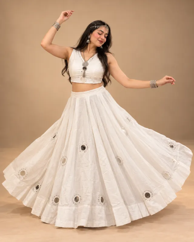 Ivory Tone-on-Tone Mirror Work Lehenga — mid-turn with the mirrors catching