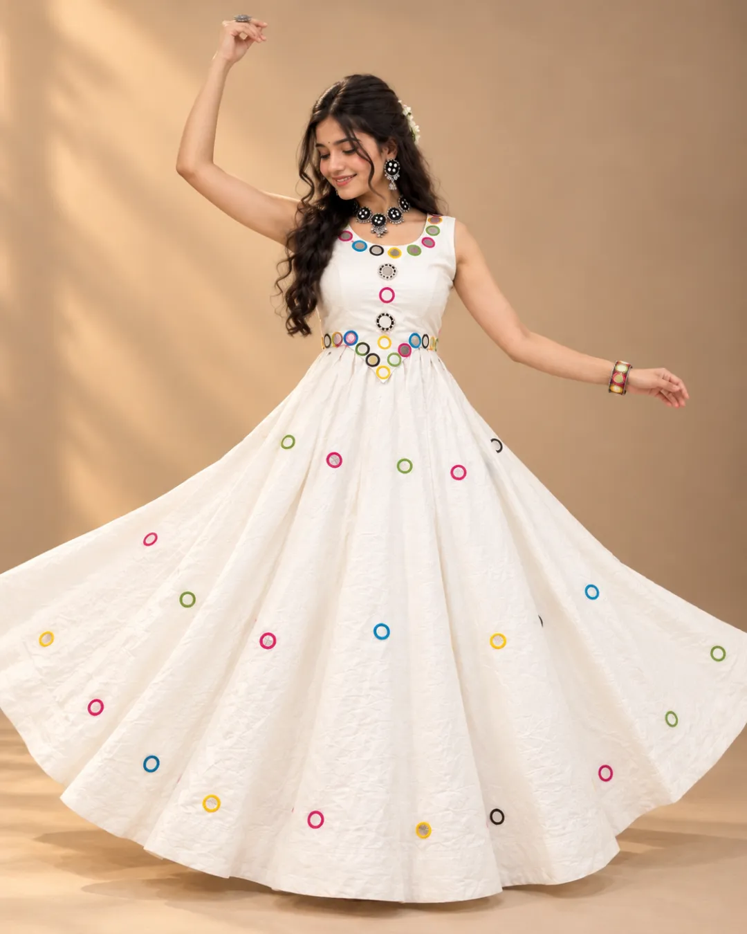 Ivory Flared Gown with Colourful Ring Embroidery — mid-turn with the skirt open