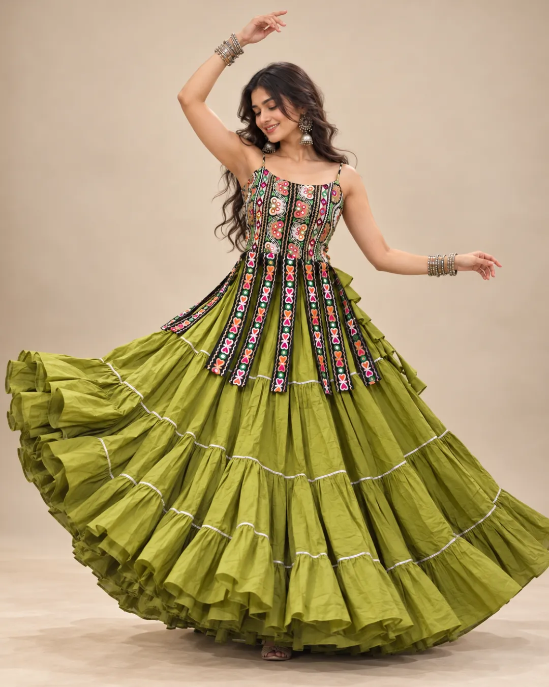 Mehendi Green Tiered Dress with Embroidered Overlay — mid-turn with the skirt open