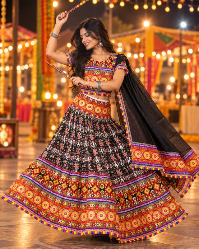 Black Folk Print Garba Lehenga — dancing with dandiya sticks