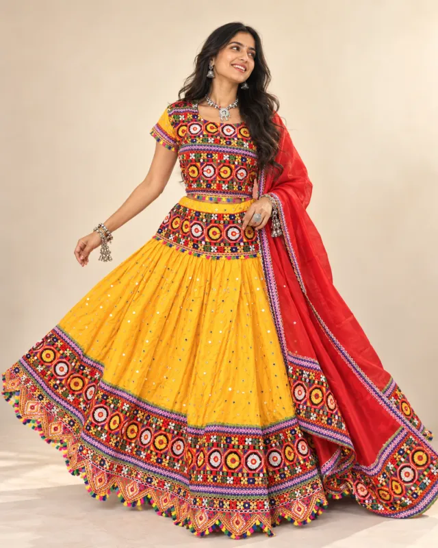 Yellow Mirror Work Lehenga with Red Dupatta — skirt spread in a twirl