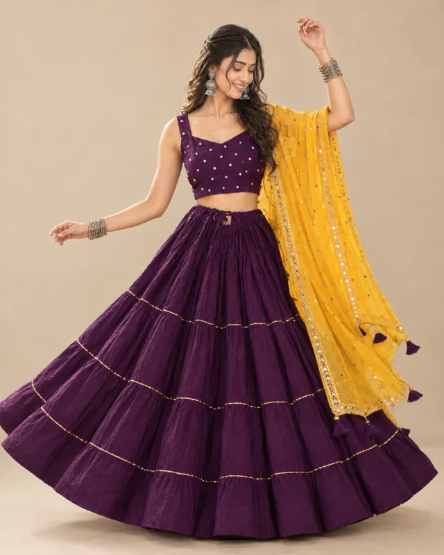Purple Tiered Lehenga with Mustard Mirror Dupatta — mid-turn with the tiers opening out