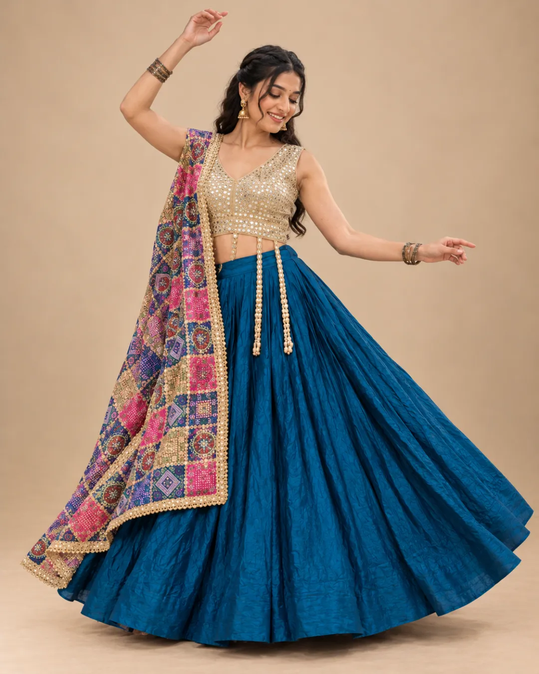 Teal Blue Lehenga with Mirror Choli and Patola Dupatta — mid-turn with the skirt and dupatta flying