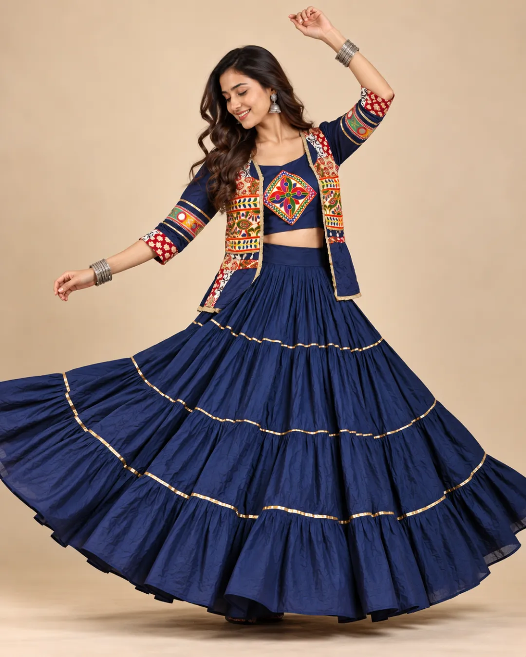 Navy Tiered Lehenga with Embroidered Jacket — mid-turn with the tiers open