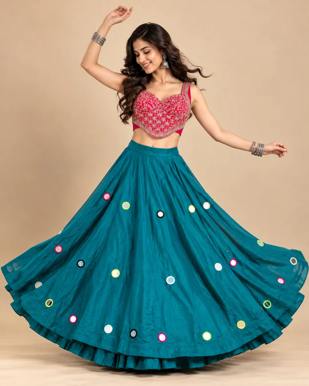 Teal Mirror Work Lehenga with Pink Embroidered Choli — mid-turn with the ruffle hem lifting