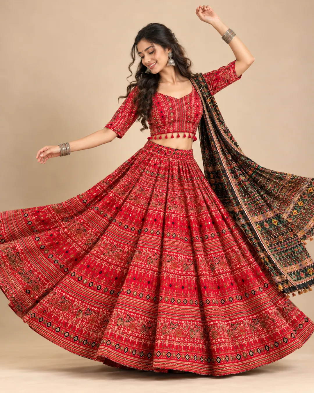 Red Patola Print Lehenga with Tasselled Dupatta — mid-turn with the print opening out
