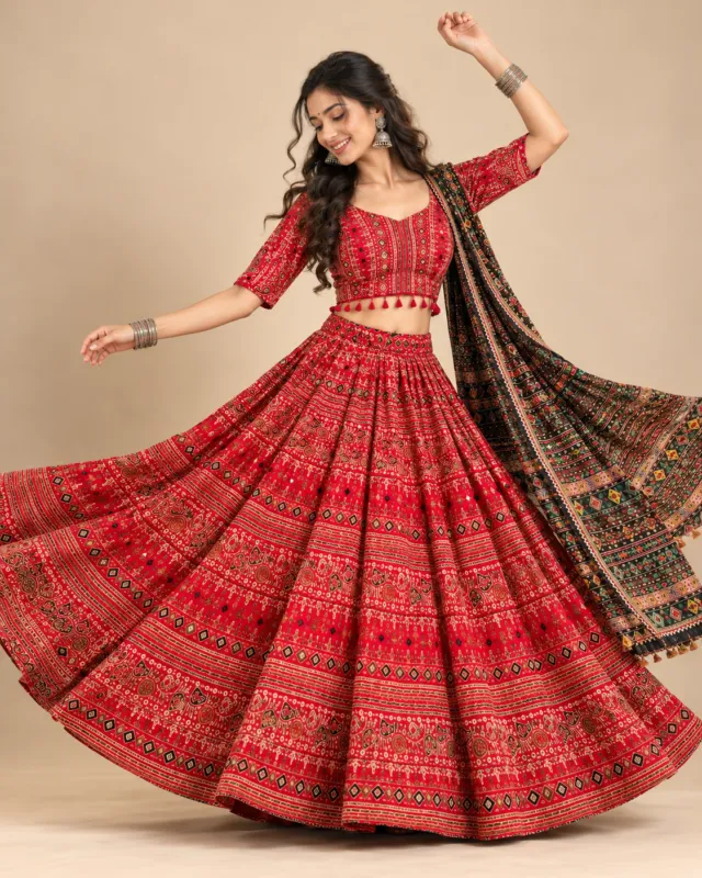 Red Patola Print Lehenga with Tasselled Dupatta — mid-turn with the print opening out