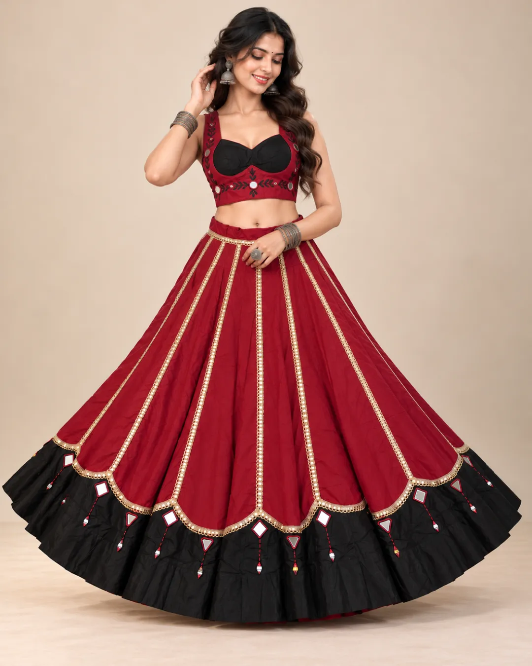 Maroon Panelled Lehenga with Black Mirror Work Border — skirt spread to show the mirrored hem border