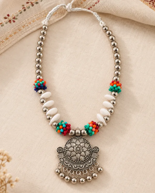 Cowrie and Turquoise Bead Necklace — flat lay with the adjustable cord