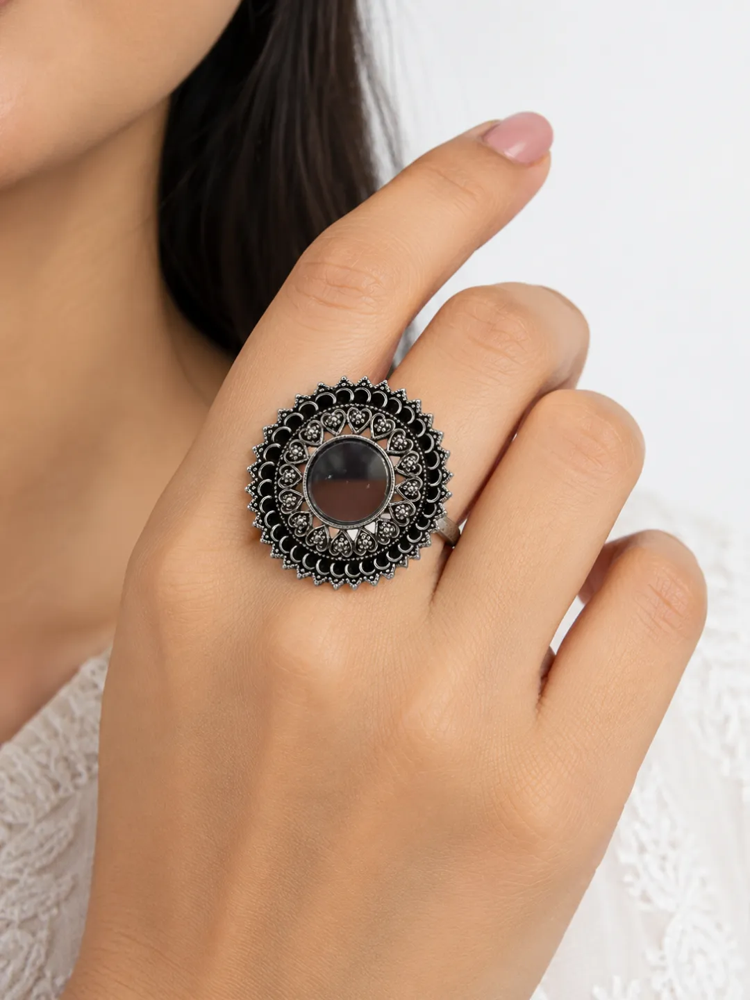 Dark Stone Filigree Ring — worn on the hand