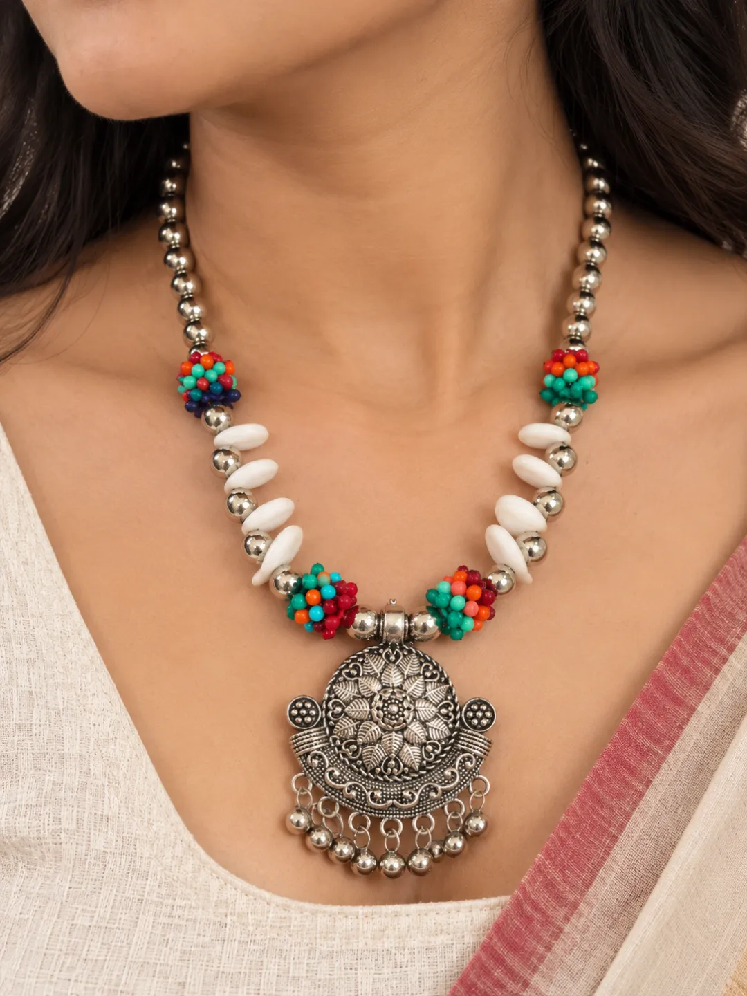 Cowrie and Turquoise Bead Necklace — close-up on the neckline