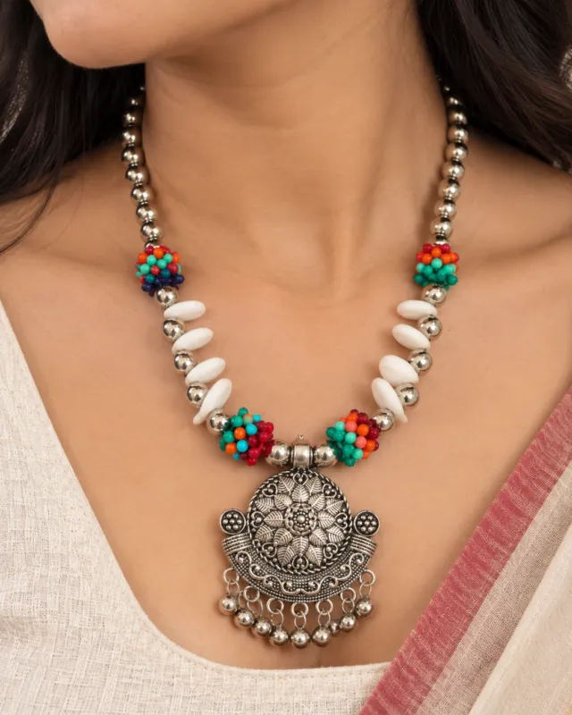Cowrie and Turquoise Bead Necklace — close-up on the neckline