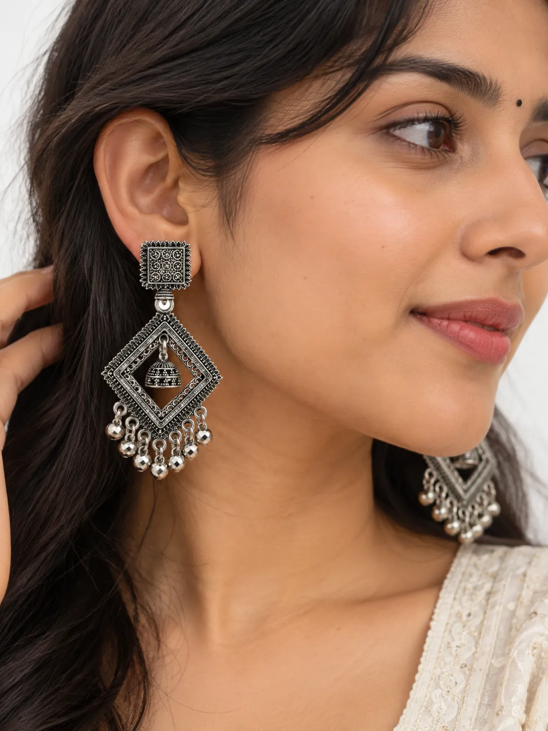 Diamond Frame Jhumka Earrings — worn by a model