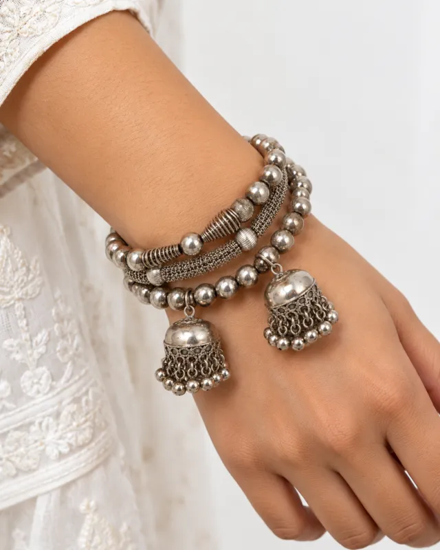 Coil Bracelet with Jhumka Drops — worn on the wrist