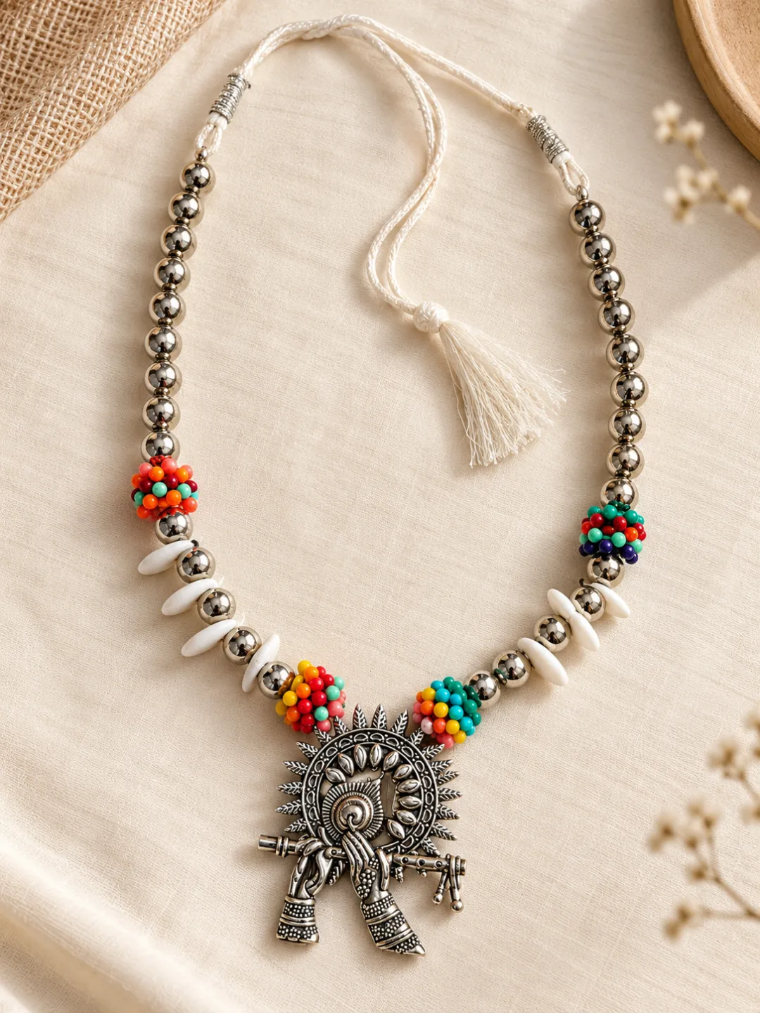 Cowrie Shell Tribal Pendant Necklace — flat lay with the adjustable cord