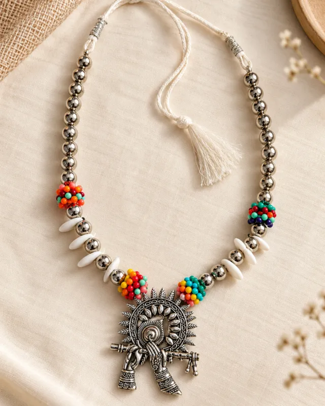 Cowrie Shell Tribal Pendant Necklace — flat lay with the adjustable cord