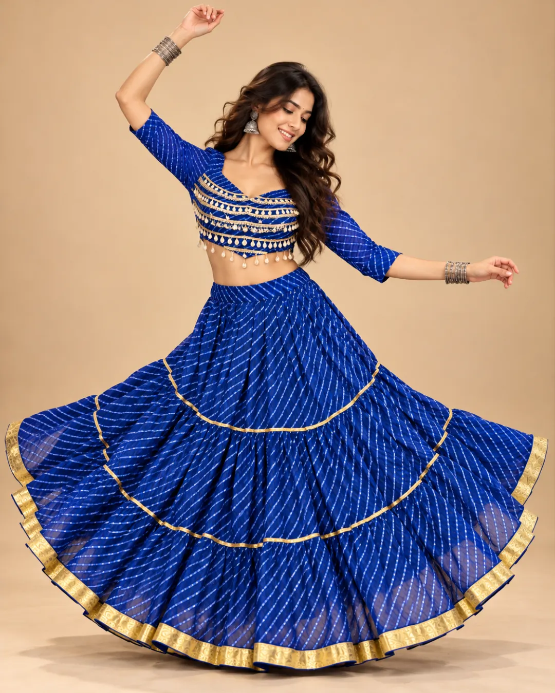 Royal Blue Leheriya Tiered Lehenga with Gold Border — mid-turn with the gold bands catching