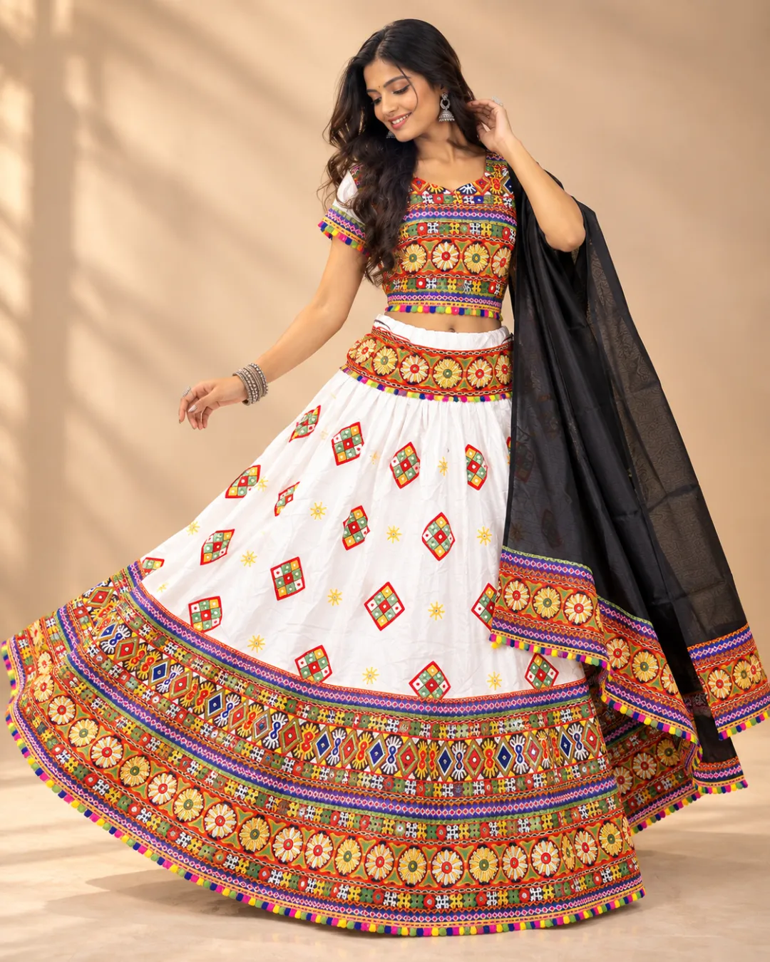 White Embroidered Chaniya Choli with Black Dupatta — skirt spread in a twirl