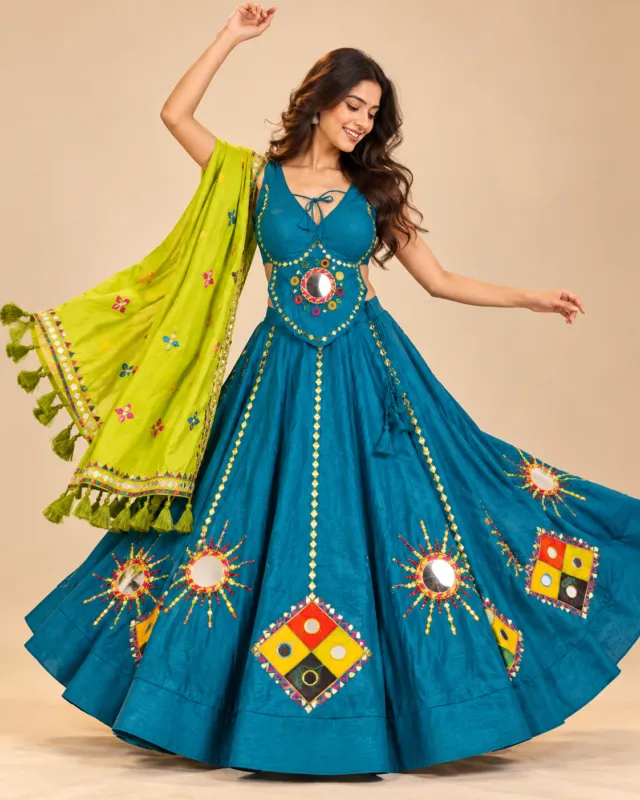 Teal Lehenga with Sunburst Mirror Work and Lime Dupatta — mid-turn showing the sunburst mirrors